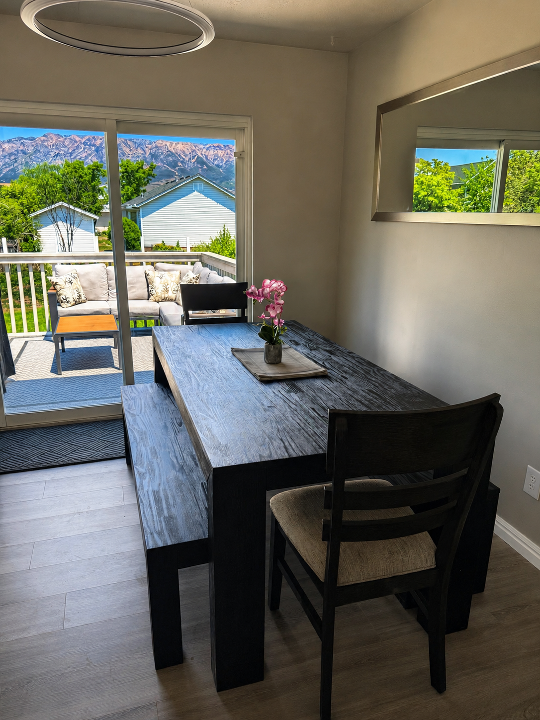 Dining area with mountain views through sliding glass door